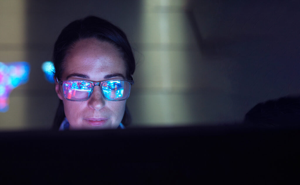 a woman on a laptop working with artificial intellgence